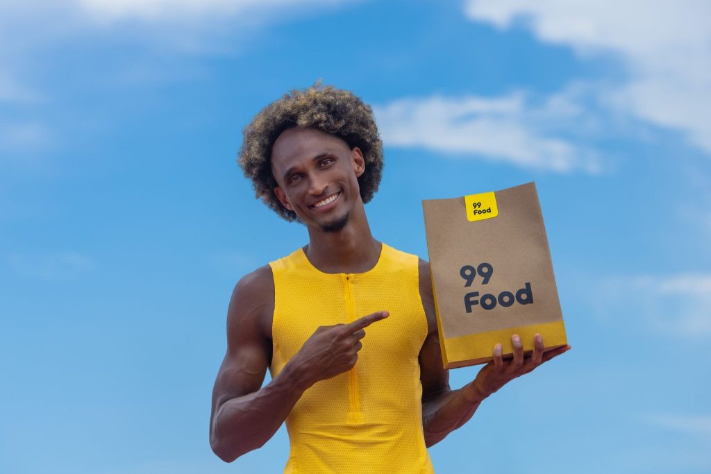 Alison dos Santos corre contra a fome em campanha da 99Food